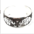 Ethnic carved open Miao silver bracelet with Roman shape in turtle colour option showing detailed openwork carving