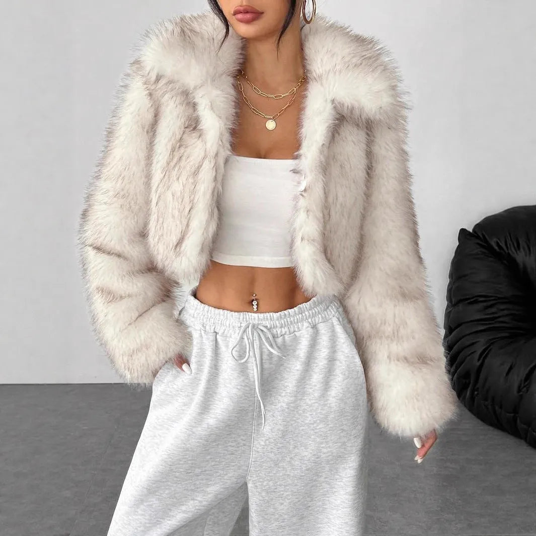 A woman's short-length artificial fur coat with a faux fur collar in a plush grey Maojian tea colour.