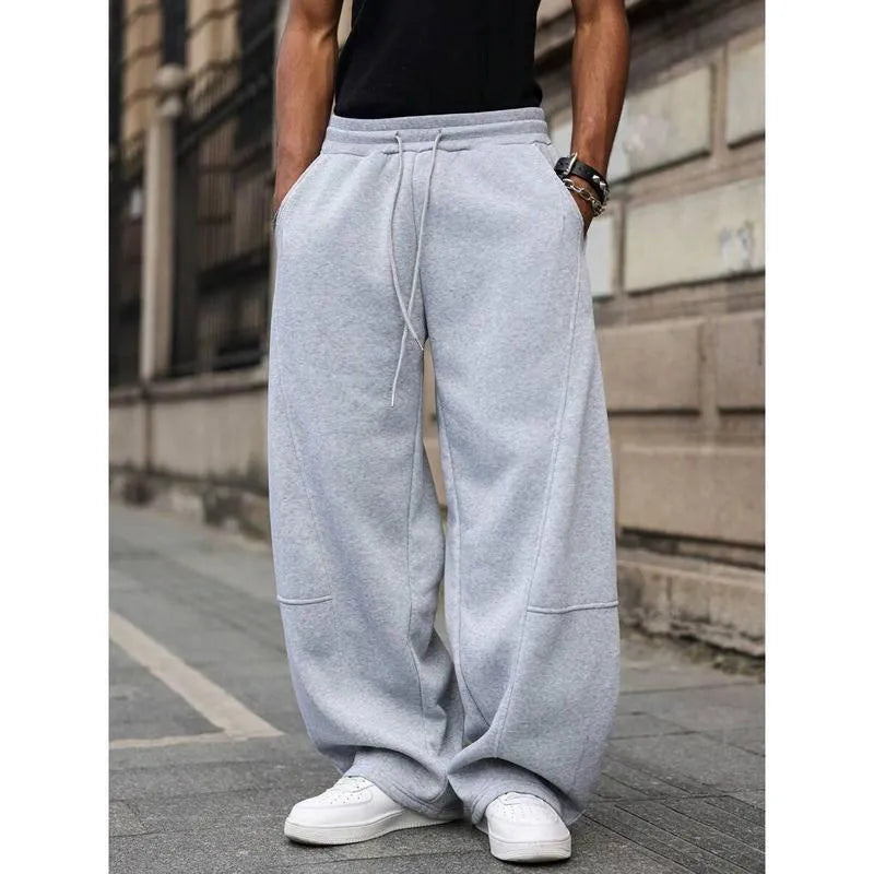 Men's straight-leg high-waist trousers in a cropped length, shown in a dark grey colour.