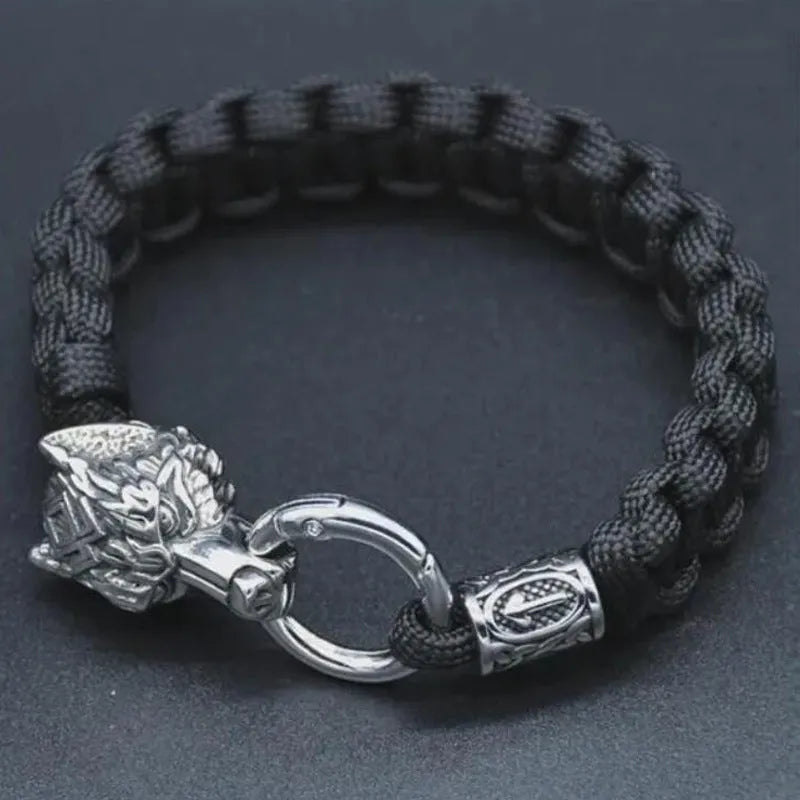 Handmade titanium steel wolf head bracelet with Luen character, polished finish, camouflage colour on white background