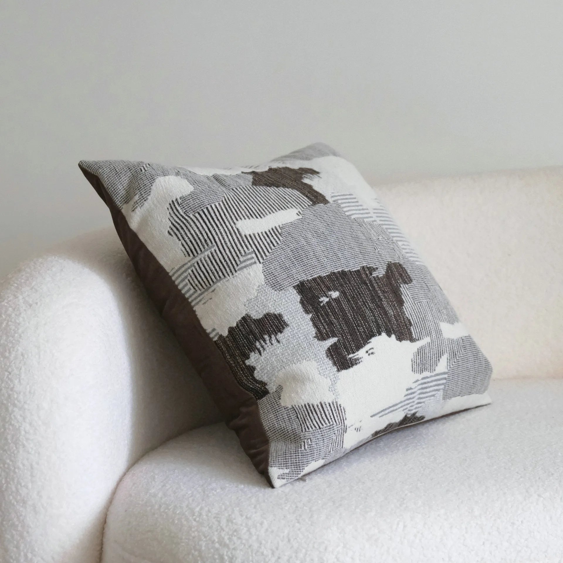 Coffee brown striped Chinese classical style decorative cushion on a sofa.