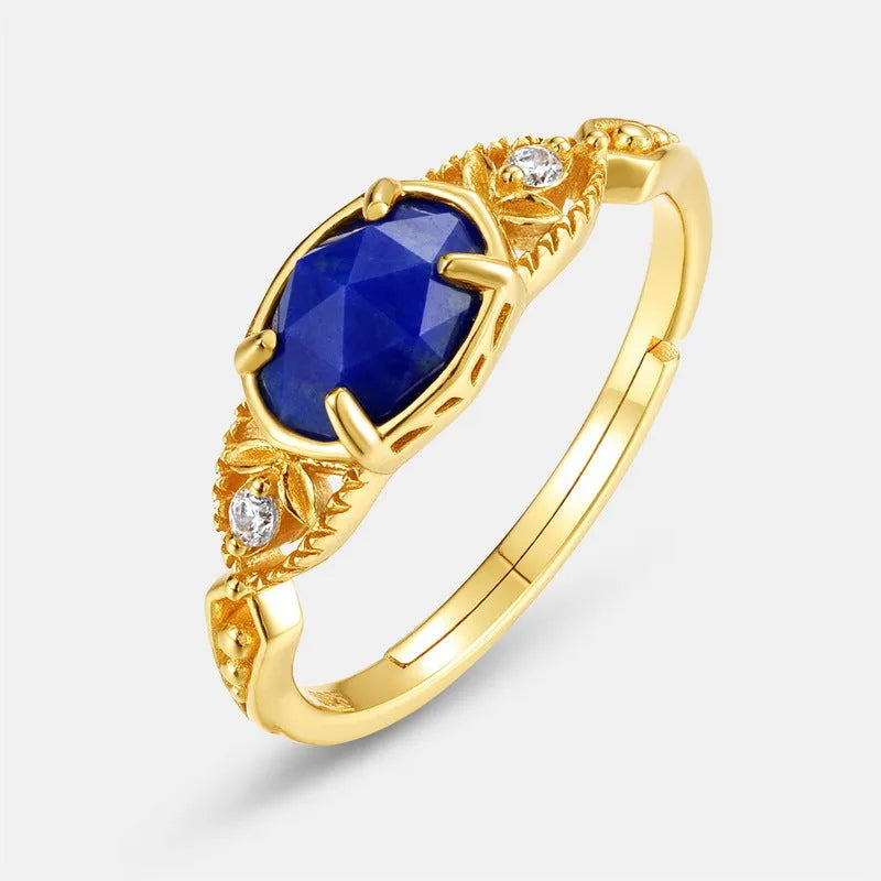 Japanese style silver alloy ring with blue lapis lazuli stone in an elliptical geometric shape.