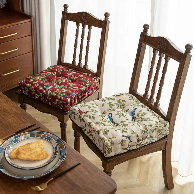 American-style square dining chair cushion with thick padding and botanical print.