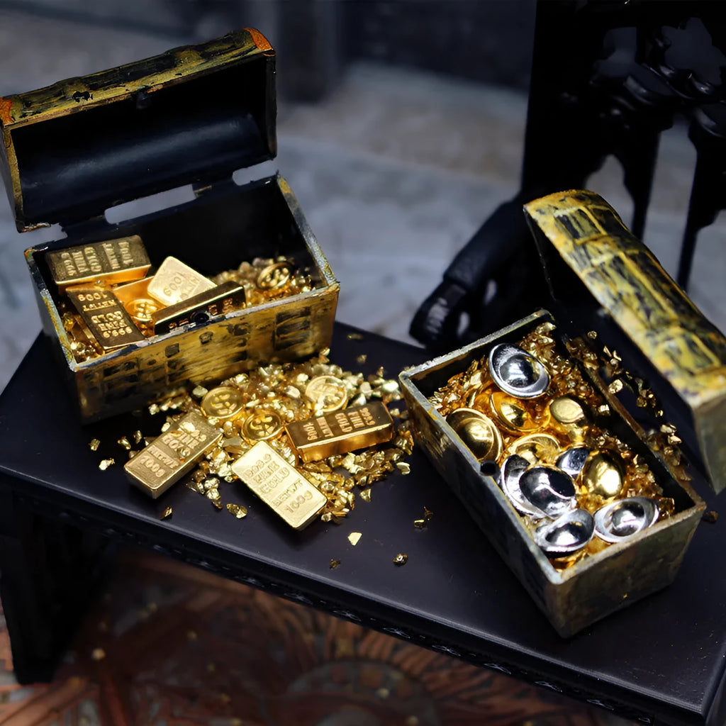 Miniature alloy gold coin and gold bar doll house accessory ornaments on display.
