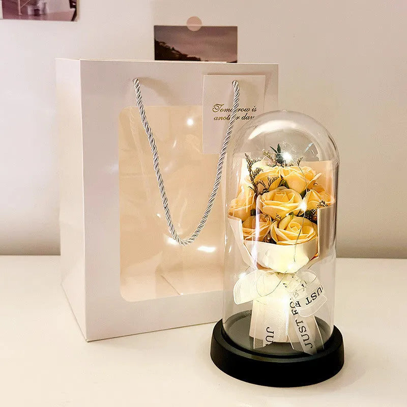 Bionic artificial flower bouquet in a decorative tote bag, showing colour options like light pink and gradient blue.
