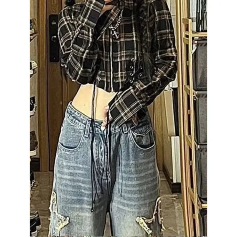 Women's blue high-waisted straight-leg jeans laid flat on a surface.