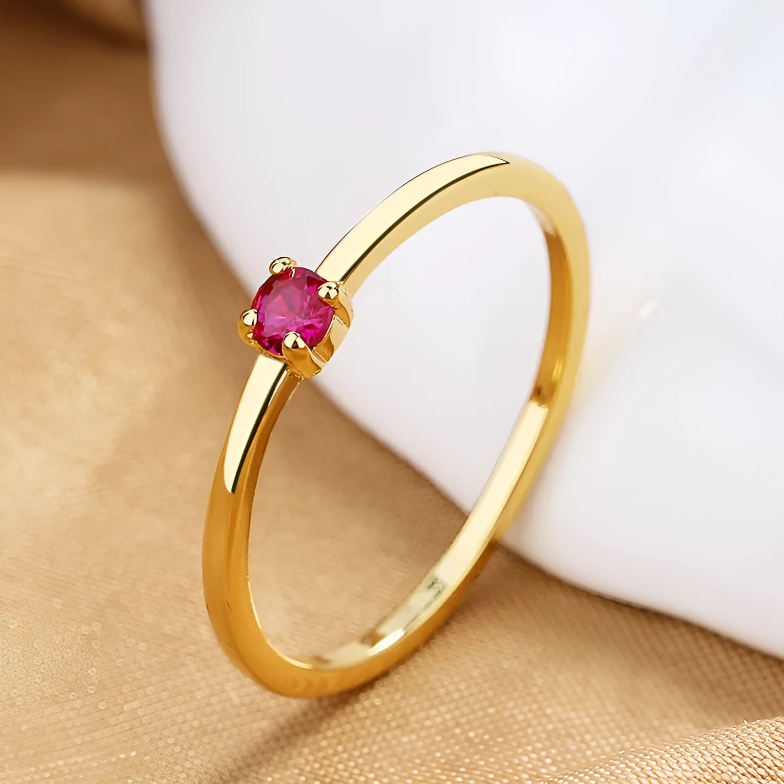 Twin style women's copper ring with a single round diamond, shown in blue, green, red, and white colour options.
