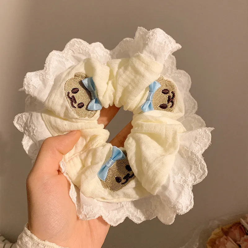 Blue bear-themed cloth headband with bow lace decoration and elastic design