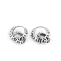 Pair of polished steel-coloured stainless steel round hoop earrings on a plain background.