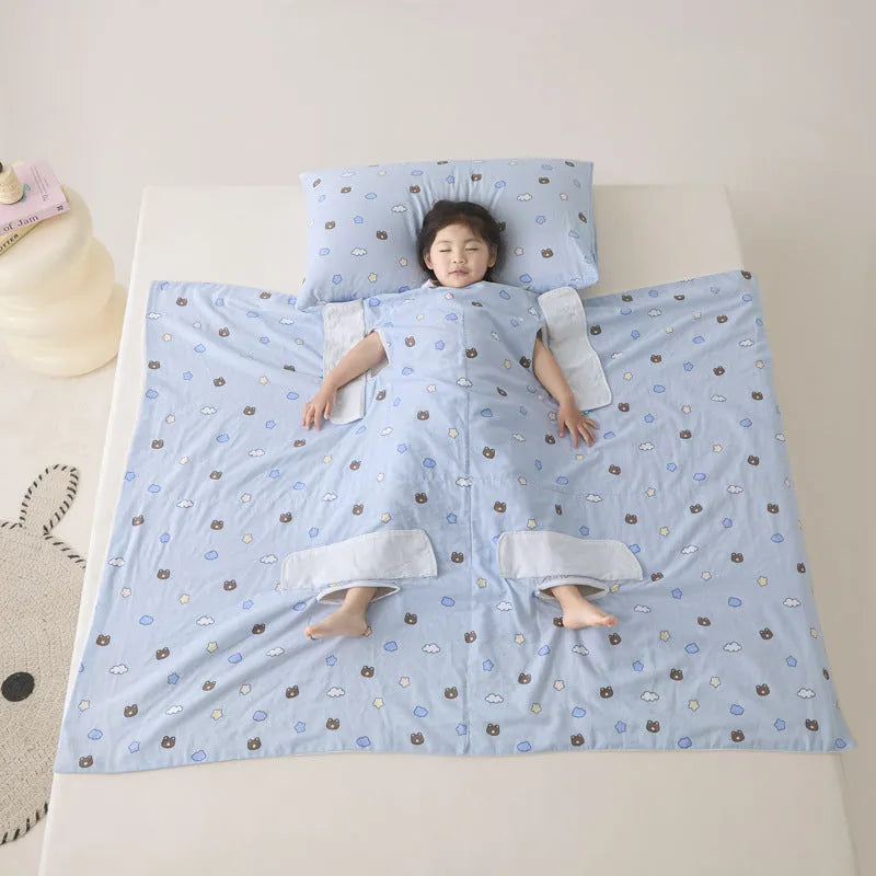 Anti-kick sleeping bag blanket in a choice of colours and sizes on a bed.