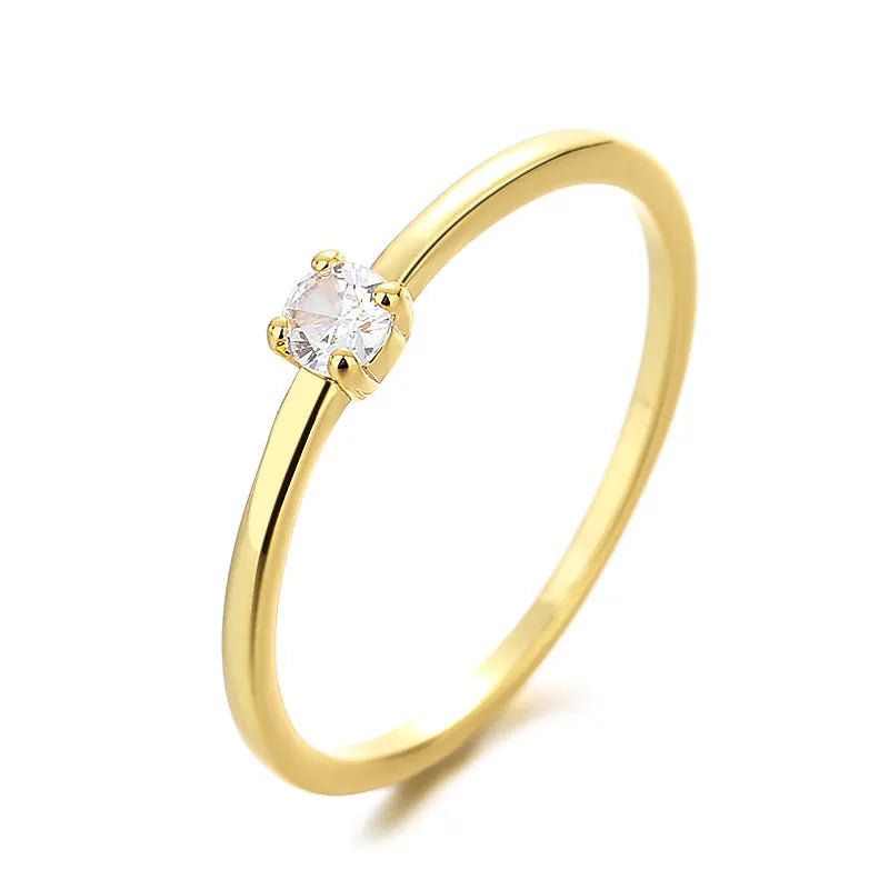 Twin style women's copper ring with a single round diamond, shown in blue, green, red, and white colour options.