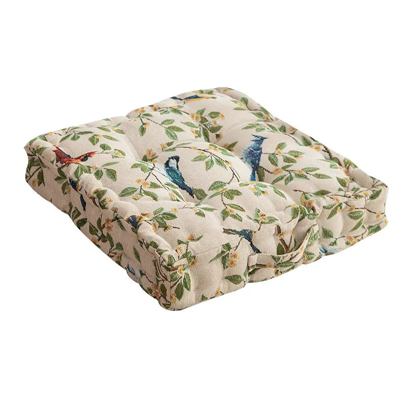 American-style square dining chair cushion with thick padding and botanical print.