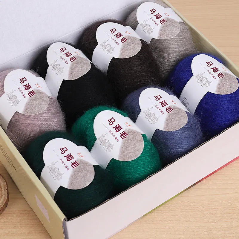 DIY mohair scarf kit showing a ball of mohair thread in a chosen colour next to an example of a hand-woven scarf