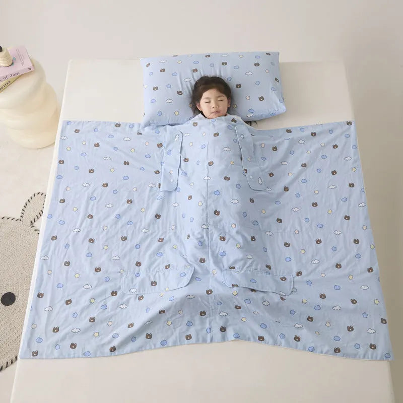 Anti-kick sleeping bag blanket in a choice of colours and sizes on a bed.