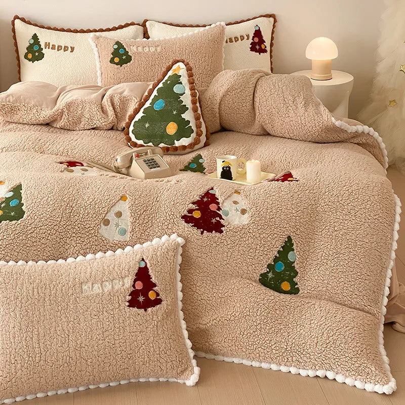 Bright yellow fleece-lined duvet cover with embroidered Christmas cartoon trees on a bed.