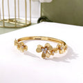 Three-leaf flower bracelet with micro inlaid zircon stones, copper base, electroplated in gold, silver, or rose gold