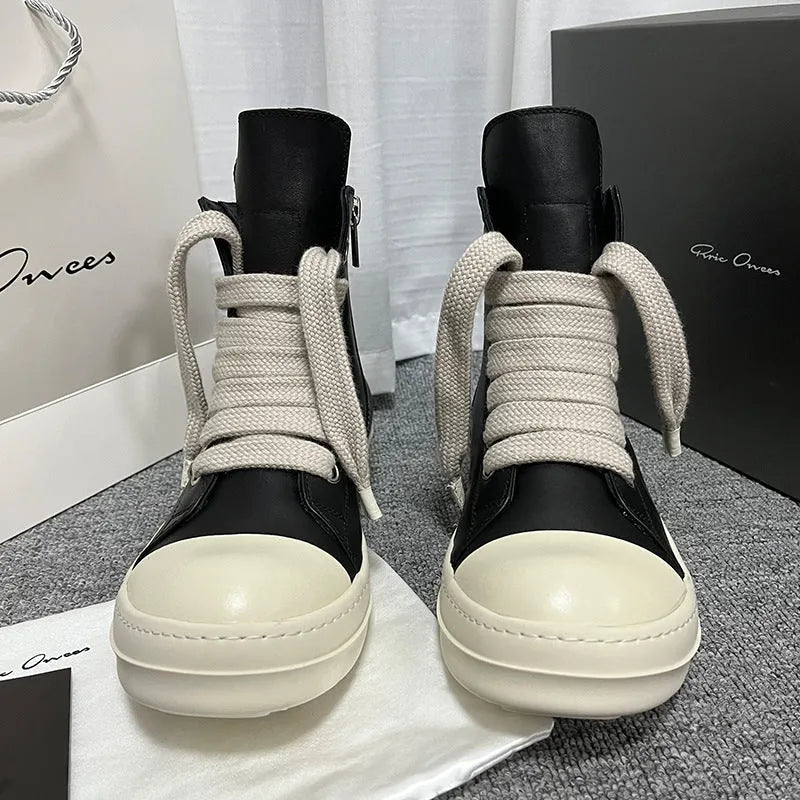 Black genuine leather high-top sneakers with a side zipper and round toe on a rubber sole.