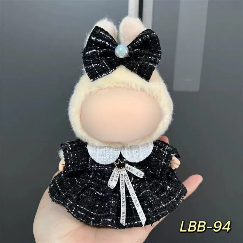 Plastic outfit for a 17cm tall vinyl doll on a white background.
