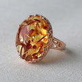 Ethnic style amber beeswax ring for women with a retro design and complimentary alloy band.