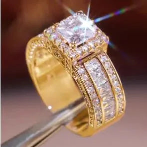 Geometric silver fashion ring for women in gold or white finish on a ring size mandrel.