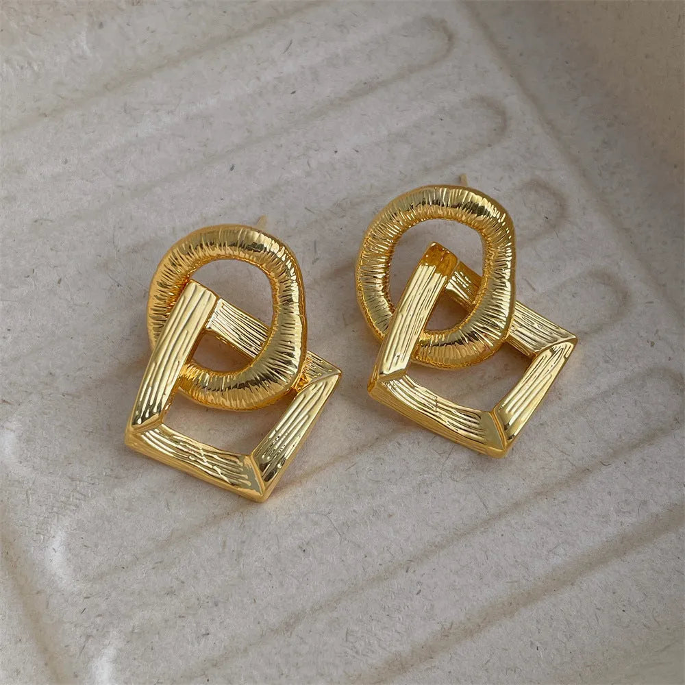 Retro geometric circle pendant earrings with 3.4 cm drop in gold or silver electroplated finish
