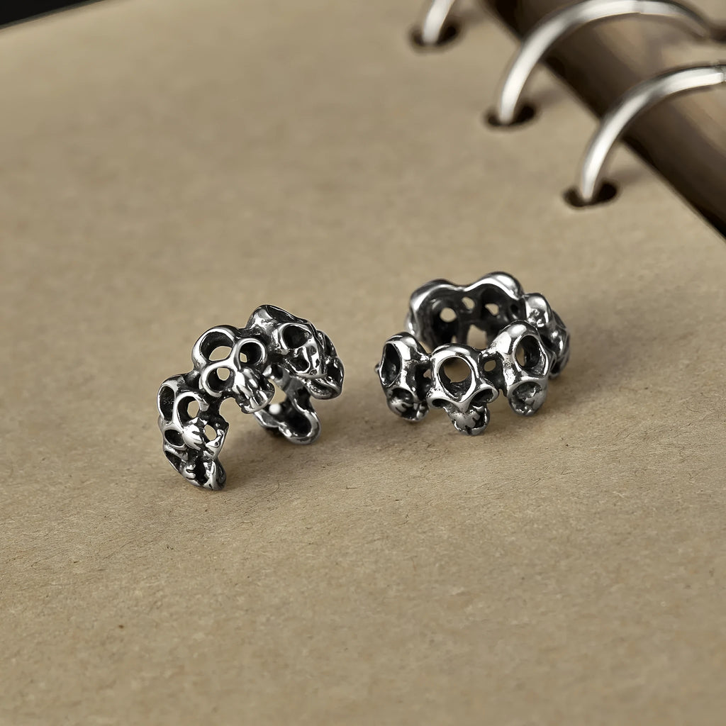 Stainless steel skull ear clips with hollow geometric design and clip-on backing
