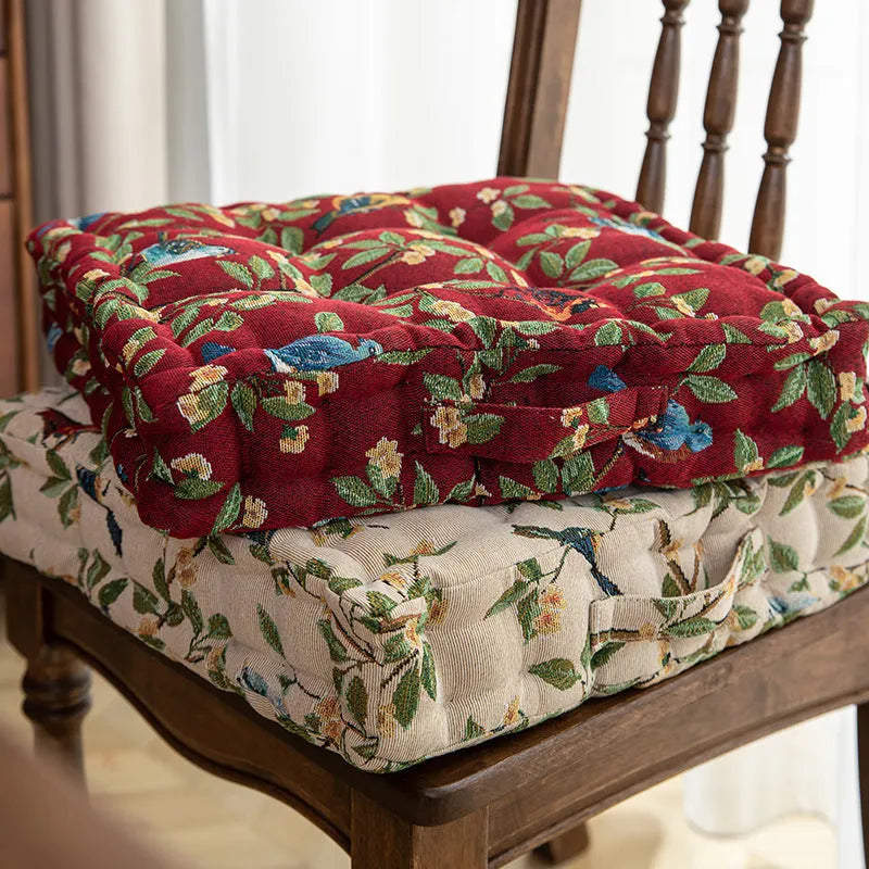 American-style square dining chair cushion with thick padding and botanical print.