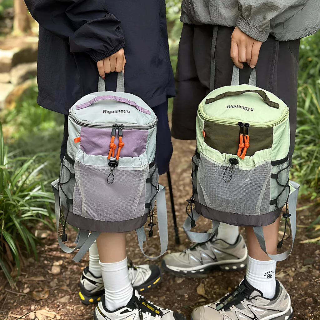Blue casual waterproof nylon backpack with curved straps and fold design.