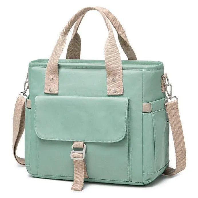 Insulated Oxford cloth picnic bag with removable shoulder strap and side pocket in black, green, or pink.