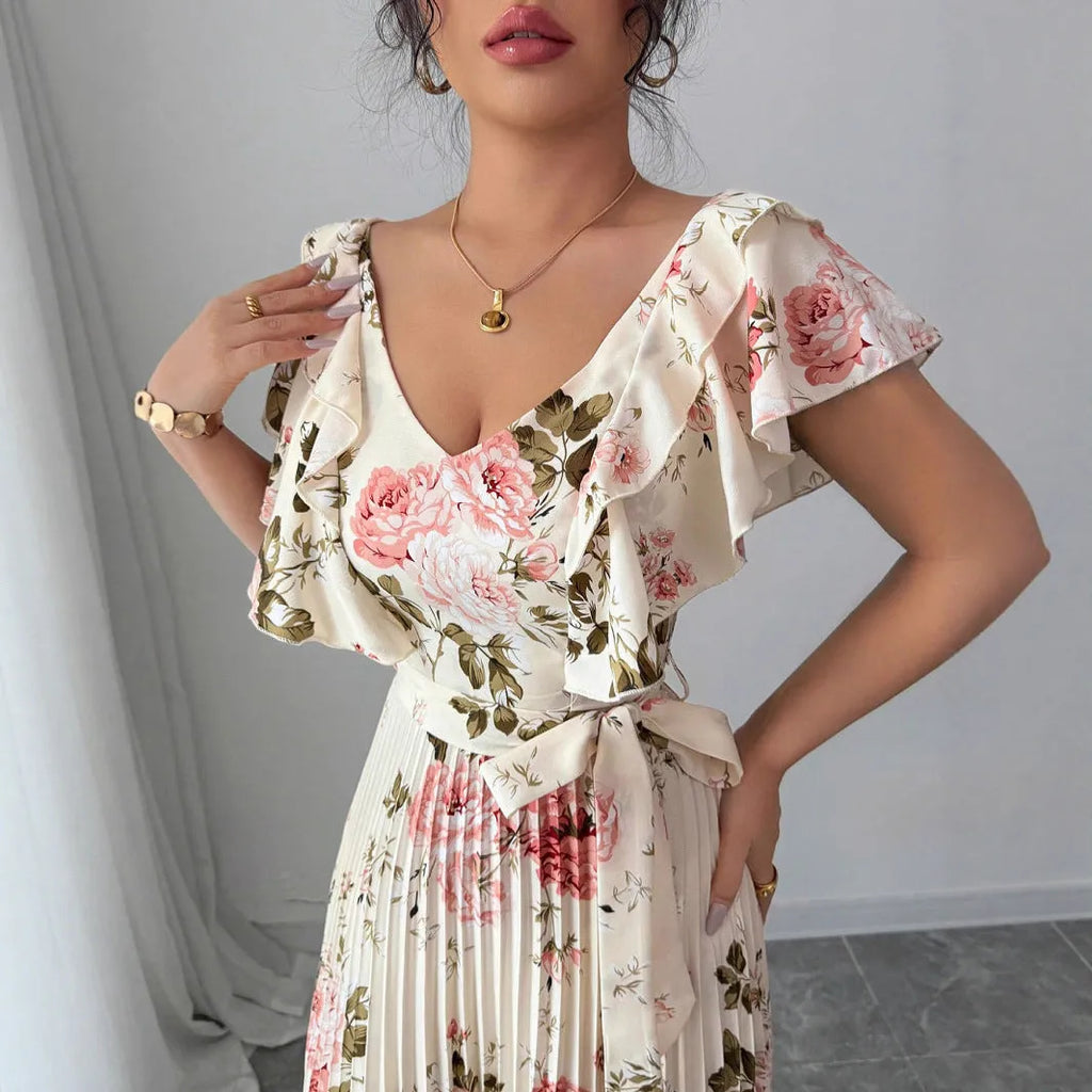 Apricot V-neck floral print dress with ruffled sleeves and a high-waisted swing skirt.