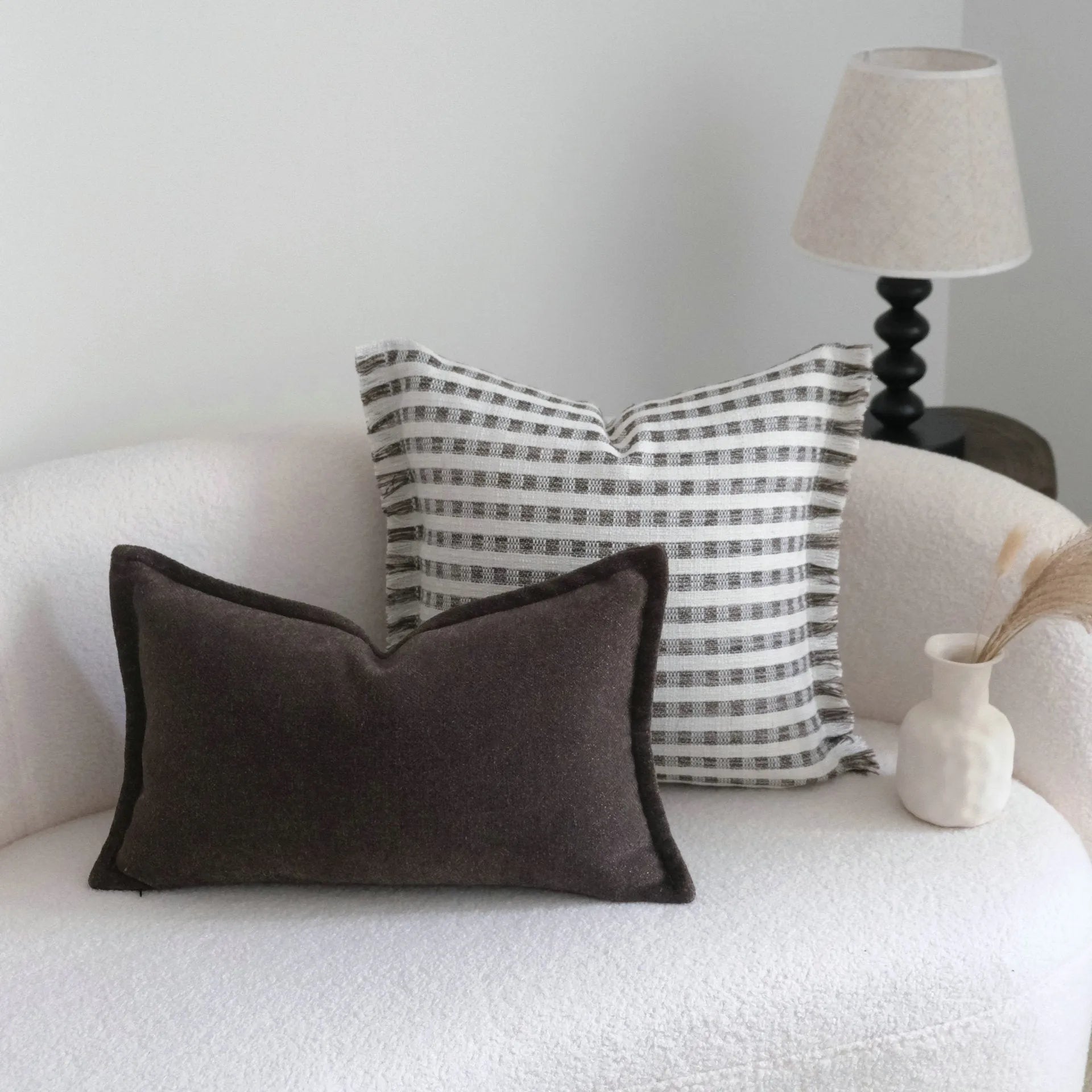 Coffee brown striped Chinese classical style decorative cushion on a sofa.