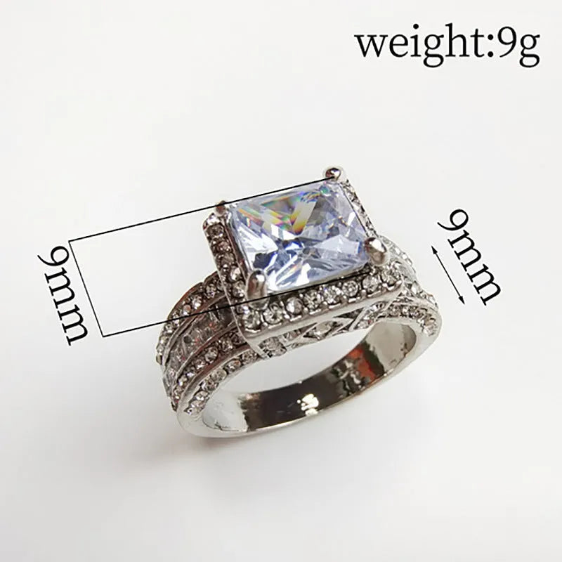 Geometric silver fashion ring for women in gold or white finish on a ring size mandrel.