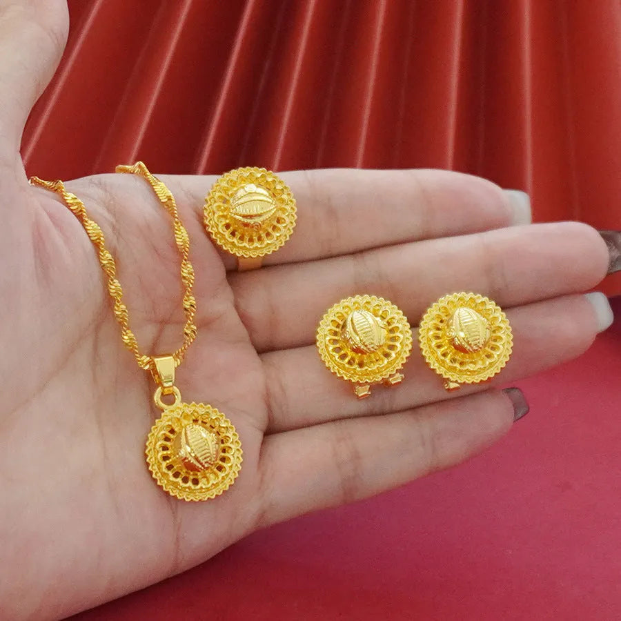 Landscape Middle East gold-plated floral jewellery three-piece set showing necklace, earrings and ring