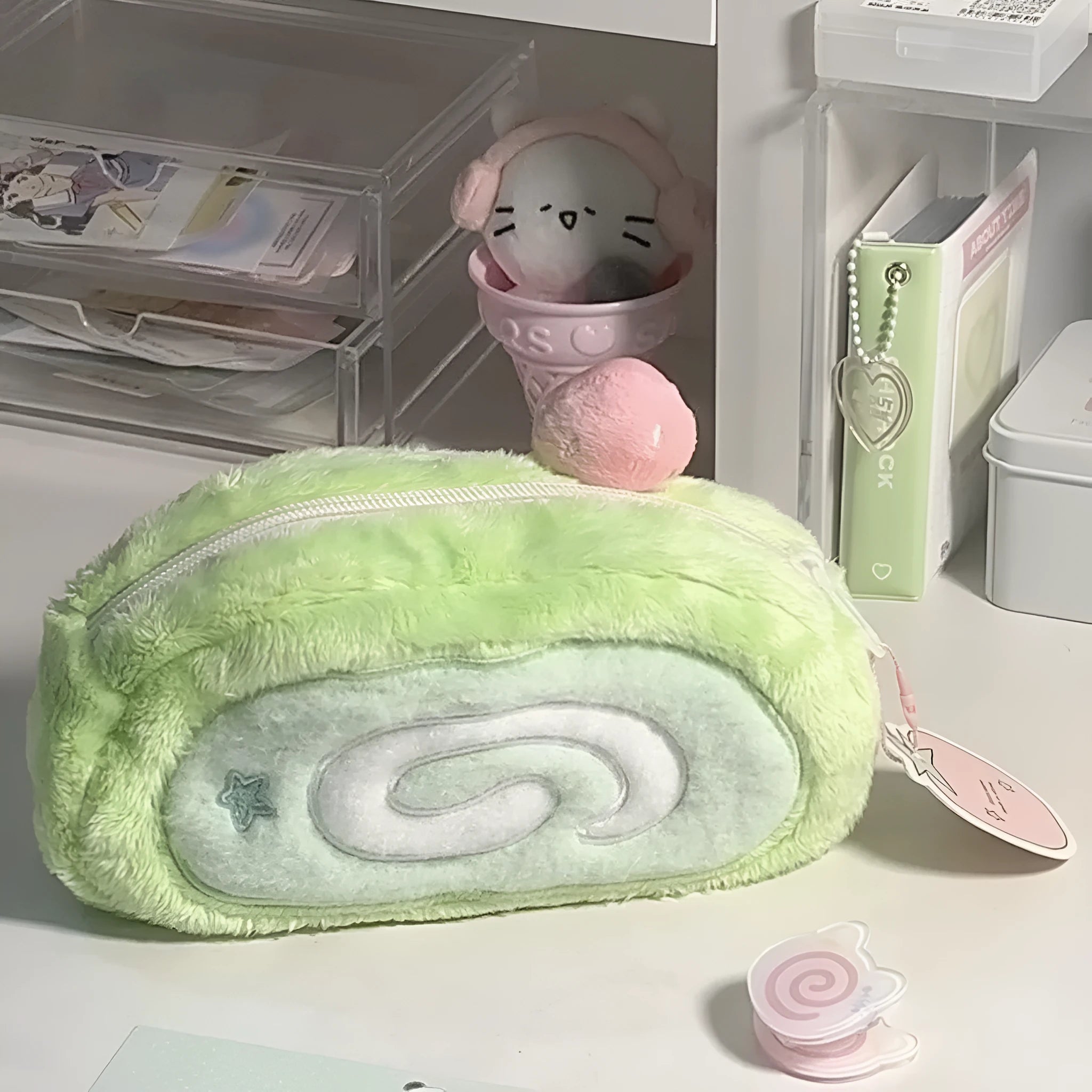 Honeydew green velvet pencil case with Swiss roll cake design, shown rolled up.