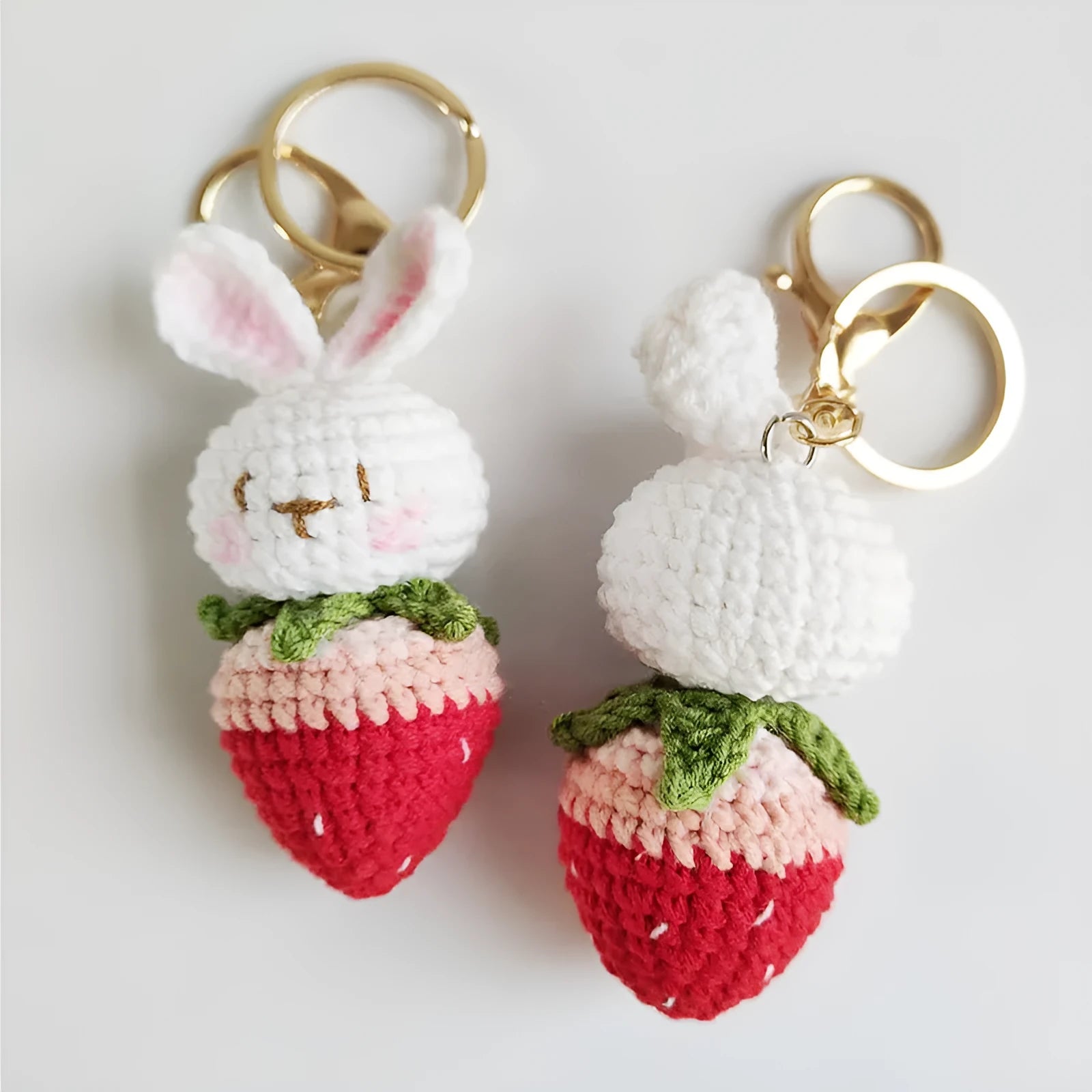 Hand-woven white doll wire pendant with a rabbit strawberry charm and an attached key
