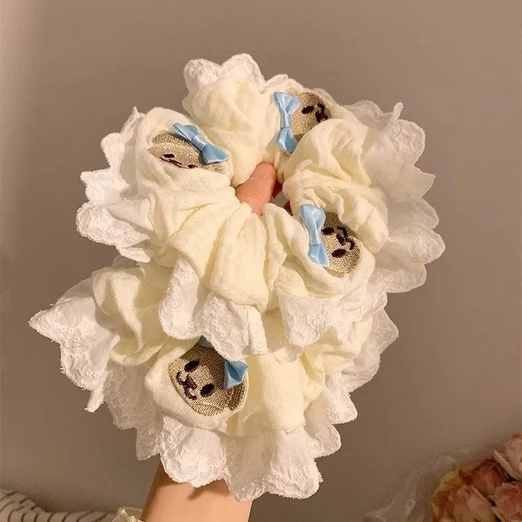 Blue bear-themed cloth headband with bow lace decoration and elastic design