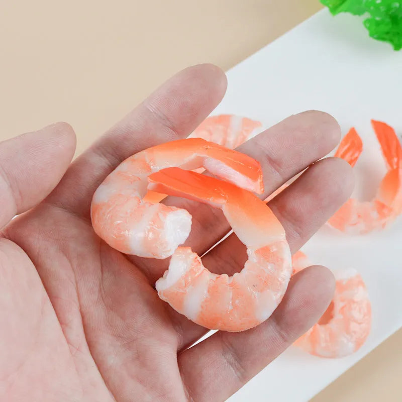 PVC injection moulded shrimp-shaped keychain and bag pendant with door buckle on white background.
