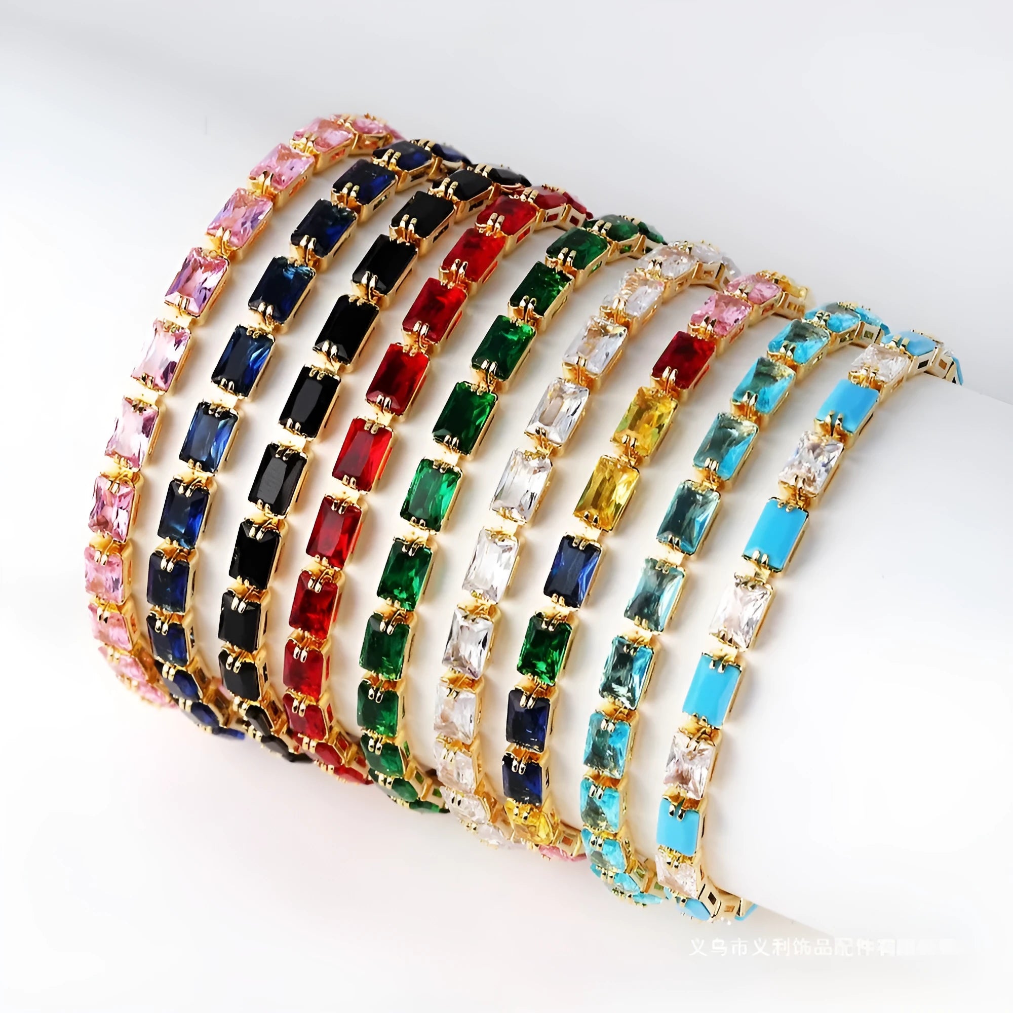Women's zircon bracelet with electroplated alloy in golden or platinum finish with coloured zircon stones