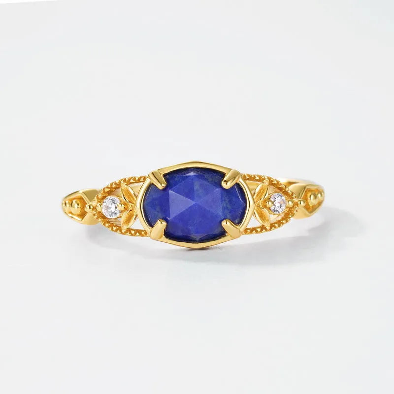 Japanese style silver alloy ring with blue lapis lazuli stone in an elliptical geometric shape.