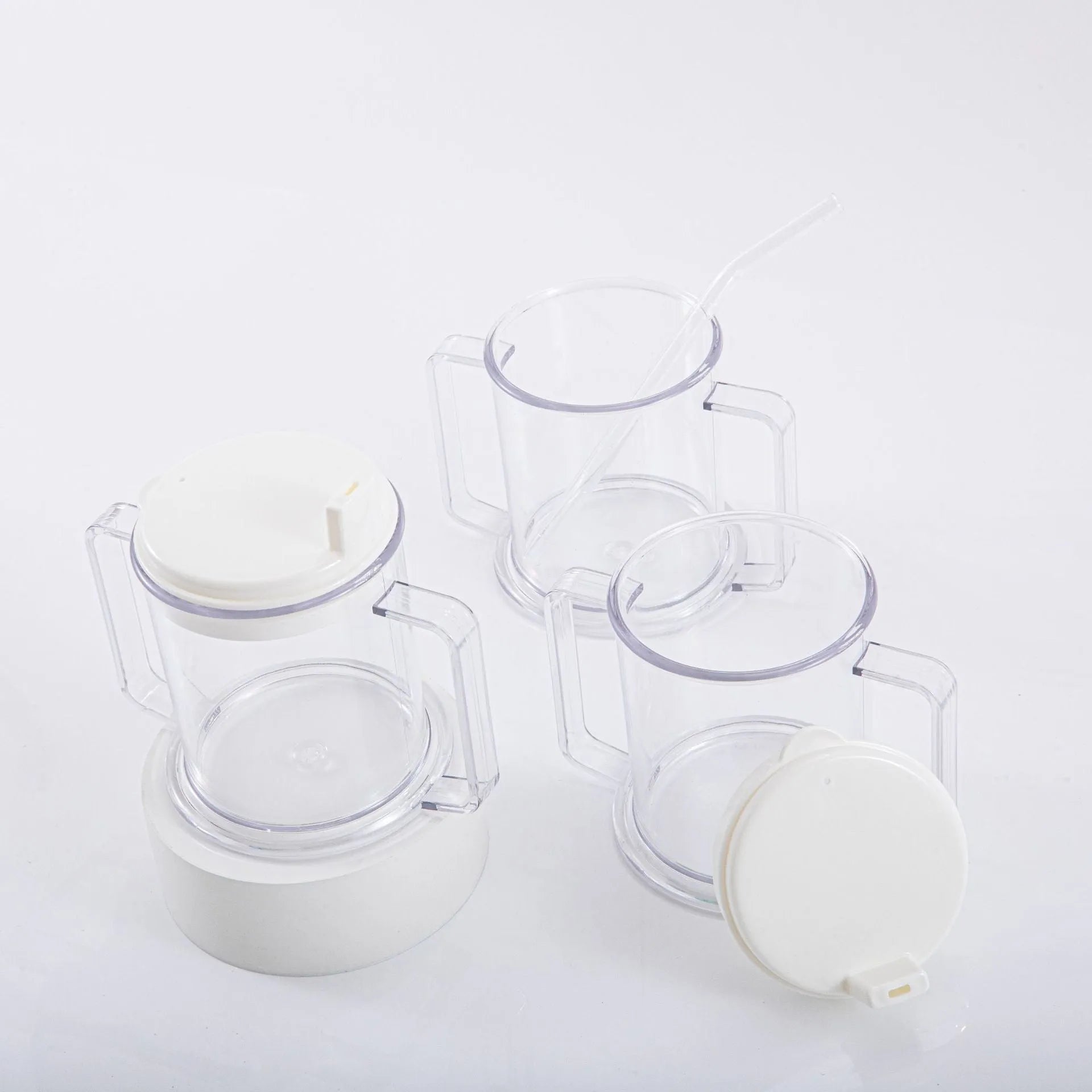 Transparent spill-proof drinking cup with solid colour, 14cm height, on table