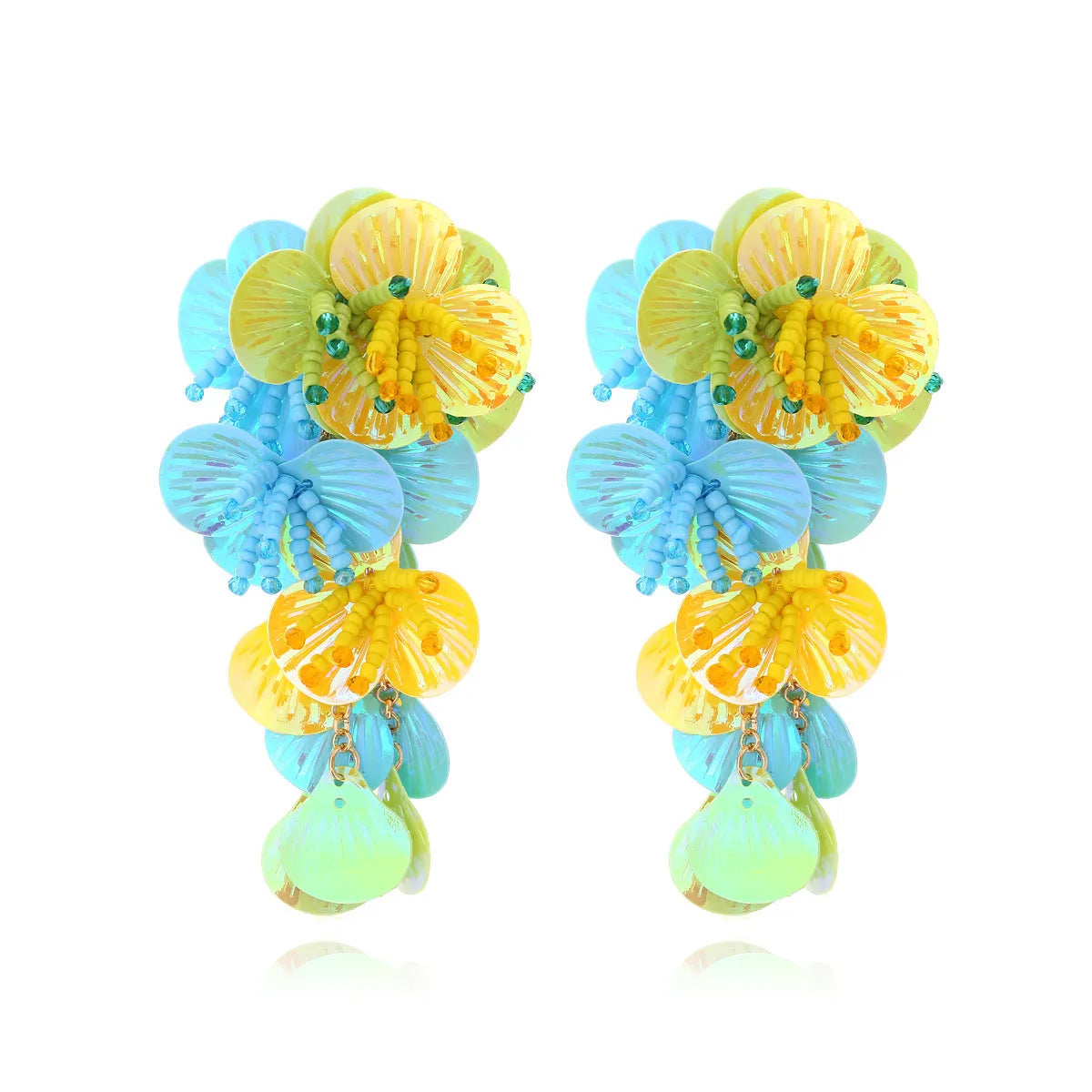 Handmade exaggerated string bead flower earrings in colourful, rose, or purple on a white background.