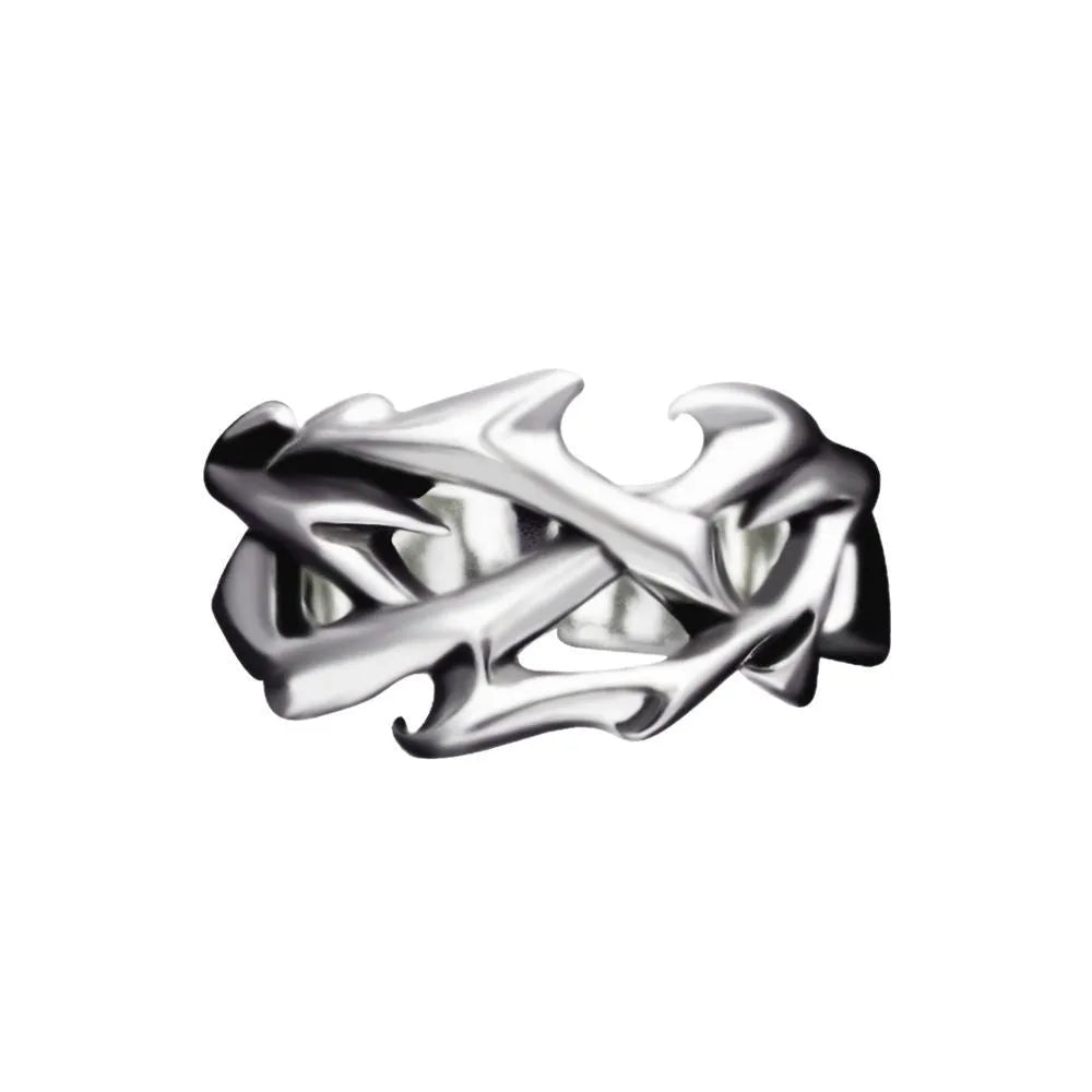 Copper geometric ring with thorn and flower design on a finger, showing adjustable opening.
