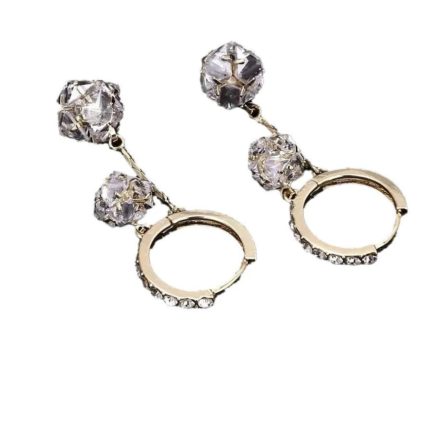 Silver drop earrings with rhinestone ball, balloon charm and tassels on ear clip fitting