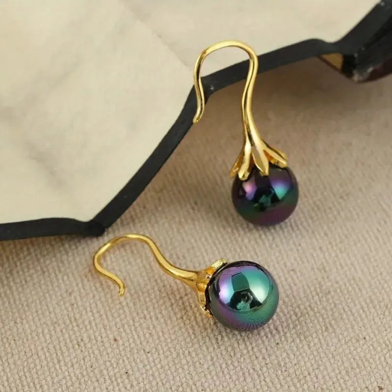 A pair of gold-colour retro fashion earrings for women with an OL style design.