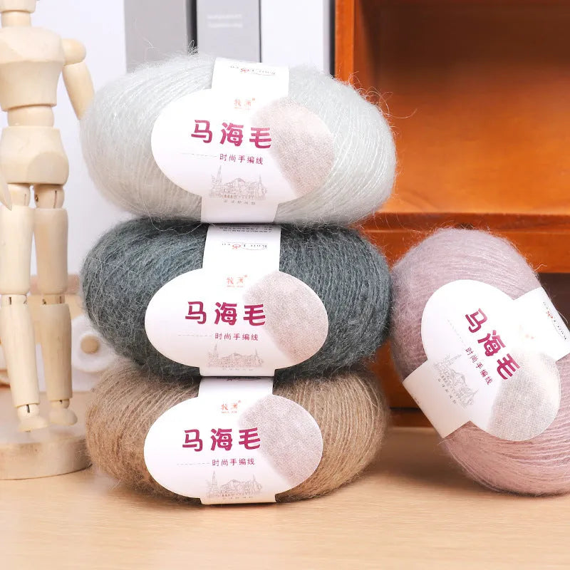 DIY mohair scarf kit showing a ball of mohair thread in a chosen colour next to an example of a hand-woven scarf