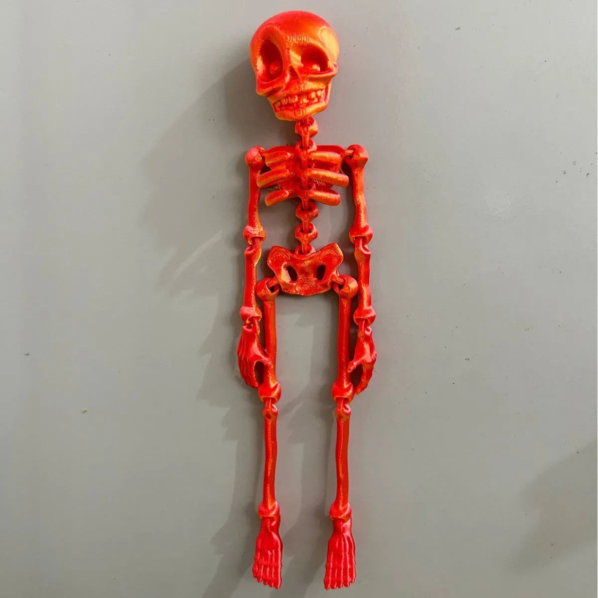 3D printed white skull fridge magnet for Halloween decoration, 18cm tall on a refrigerator.