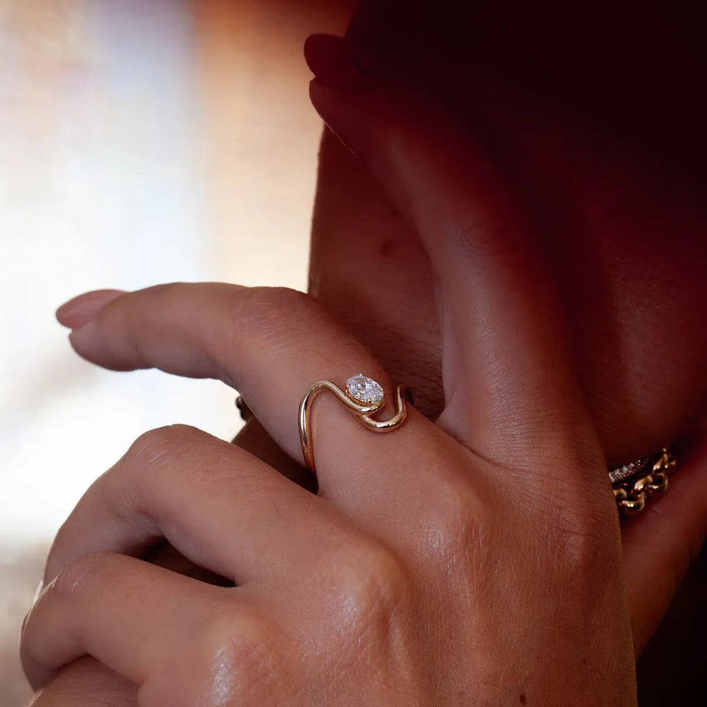 Men's titanium steel geometric zircon ring in silver tone, showing angular design.