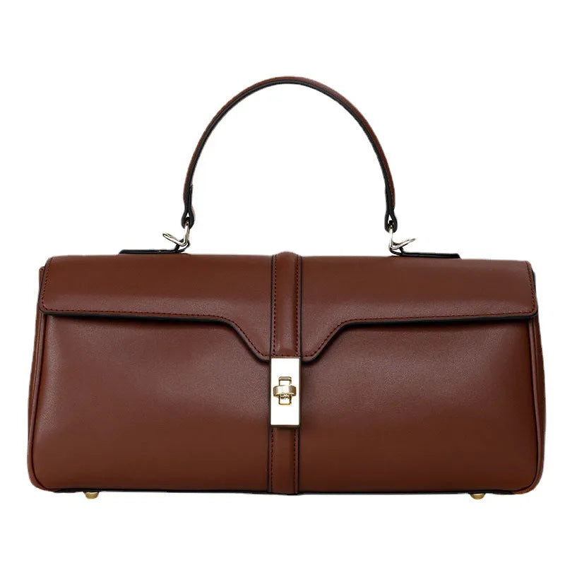 Women's cylindrical cowhide messenger bag in retro style with organised interior compartments