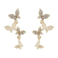 Gold-colour women's drop earrings with four butterfly charms made from copper