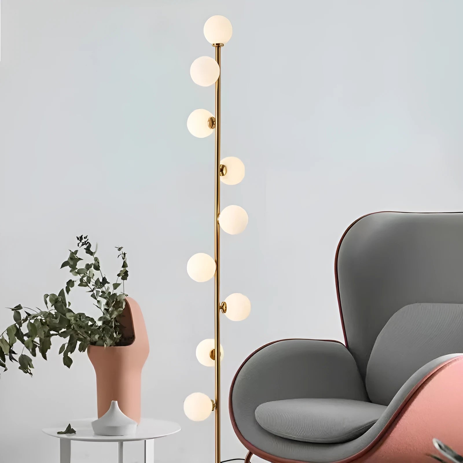 Modern minimalist floor lamp with wrought iron frame and round marble base, showing four light colour options.